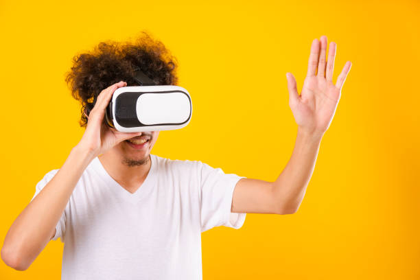 istock Asian handsome man with curly hair he using virtual reality headset or VR glass 1206187632