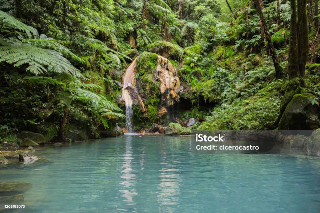Blue lagoon of natural hot spring at "Caldeira Velha" where people swim in warm water in Sao Miguel island, Azores, Portugal - Royalty-free Ponta Delgada Foto de stock
