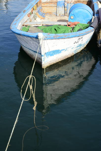 istock boat docked in the small village pier 1206189361