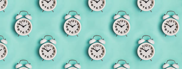istock Retro alarm clocks on pastel background. 1206190017