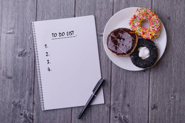 istock To do List word on a notebbok with a set of doughnut before breakfast 1206190064