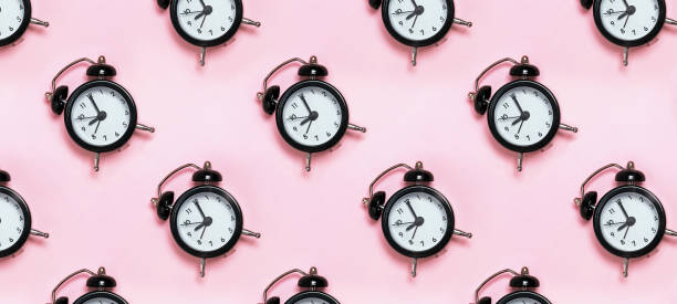 istock Retro alarm clocks on pastel background. 1206190182