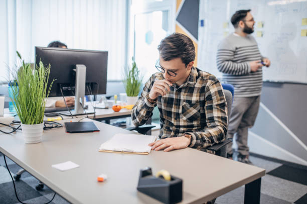 istock Young man working with colleagues in office 1206192725