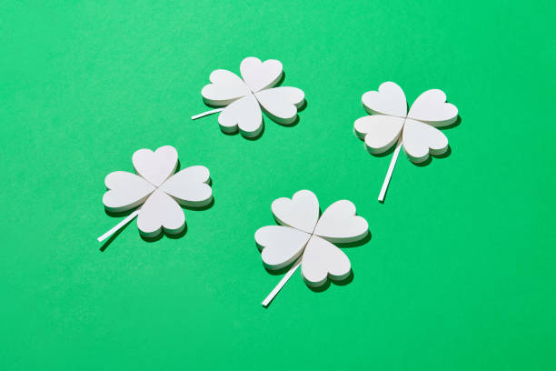 istock Papercraft composition of white shamrock's leaves. 1206194141