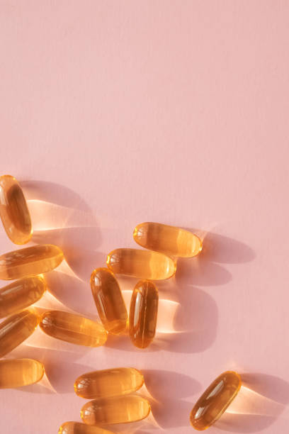 istock Pills or dietic supplements on the pink backgound 1206196854