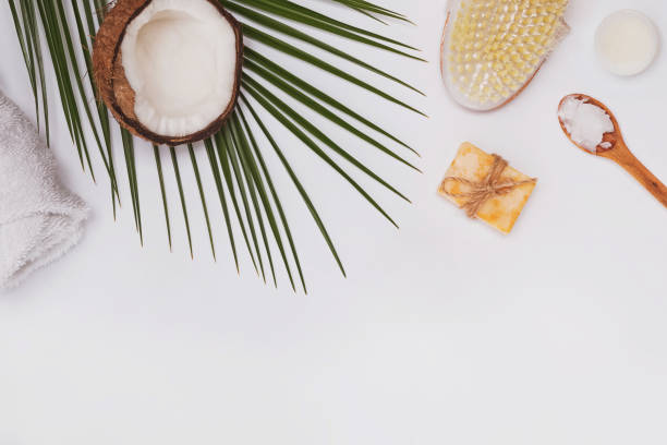 istock Coconut cosmetics and dry brush on the white table, top view. 1206196973