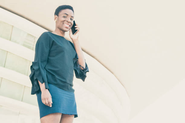 istock Happy positive woman talking on cellphone 1206202492