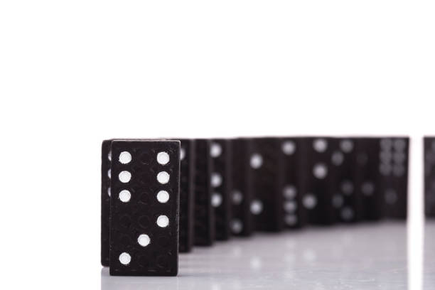 istock Domino in a row isolated on white background in studio 1206203264