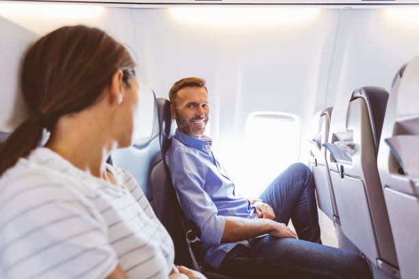 istock Two passenger talking in the airplane 1206203415