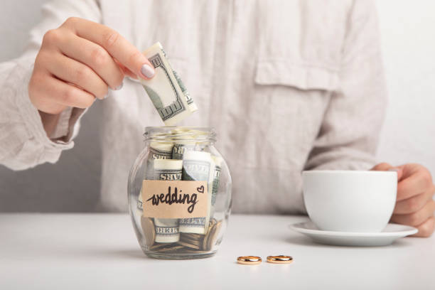 bride planning wedding and saving money in the glass jar - coin cheap jar currency imagens e fotografias de stock