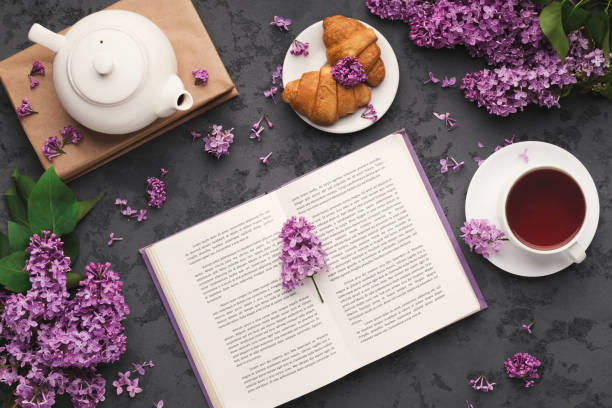 istock Spring flat lay with lilac, top view on flowers and book 1206204776