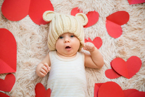 istock baby photoshoot with hearts 1206206162