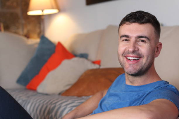 istock Relaxed man smiling at home 1206206759