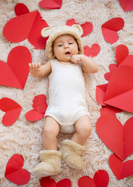 istock baby photoshoot with hearts 1206206780