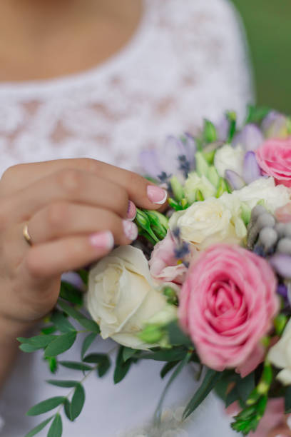 istock Young happy bride with a wedding bouquet by a bouquet 1206208019