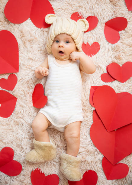 istock baby photoshoot with hearts 1206208230