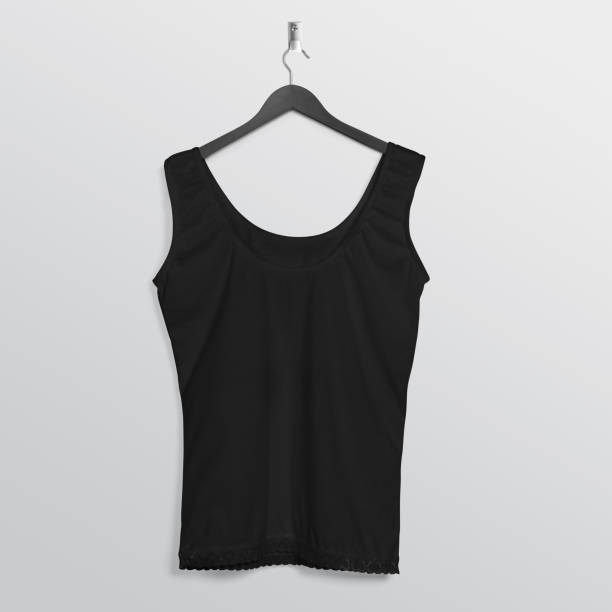 istock Plain black tank top sleeveless shirt hanging on wall 1206211077