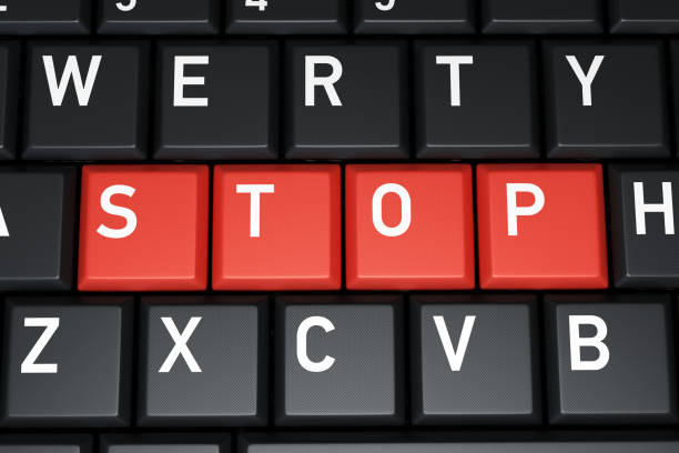 istock Red Buttons Stop Word on Computer Keyboard Stock Photo 1206212107