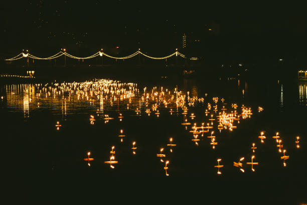 Water lantern in river at night in Loy Krathong Festival Water lantern in river at night in Loy Krathong Festival in Thailand loi krathong stock pictures, royalty-free photos & images