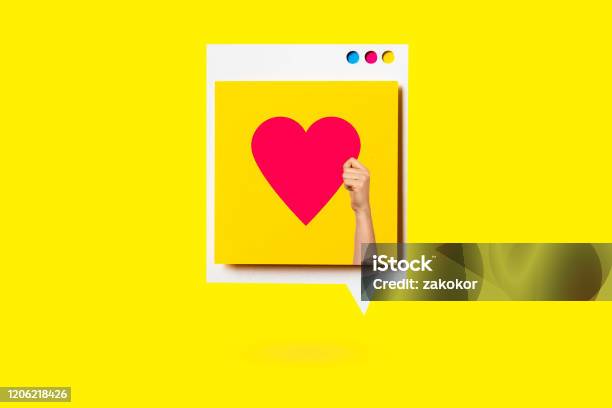 Paper Cutout Of Red Heart Symbol On A White Speech Bubble On Yellow Background Concept Of Social Media And Digital Marketing Stock Photo - Download Image Now
