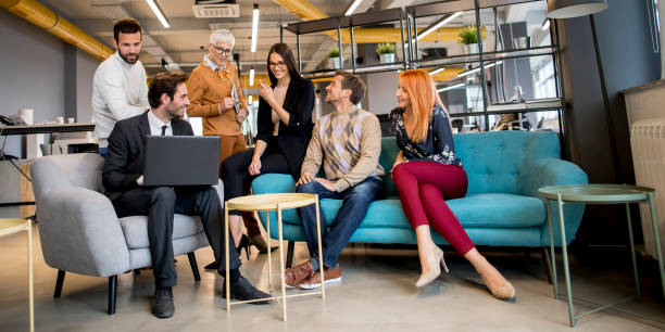 Smiling diverse businesspeople talking together in an office