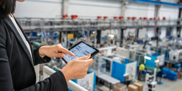 istock Female manager using digital tablet in factory 1206225979
