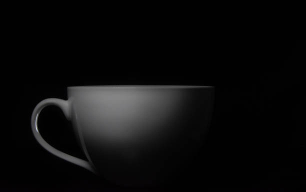 istock white porcelain cup on black background 1206228653