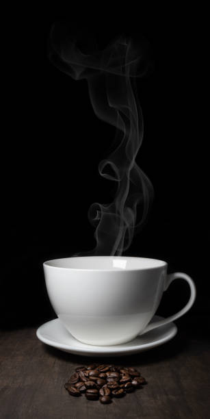 istock white porcelain cup on black background with smoke 1206228686
