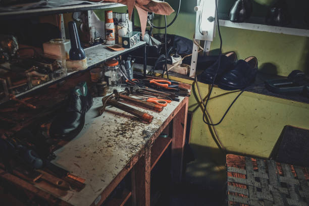 istock Workplace of cobbler with necessary tools on it 1206228709