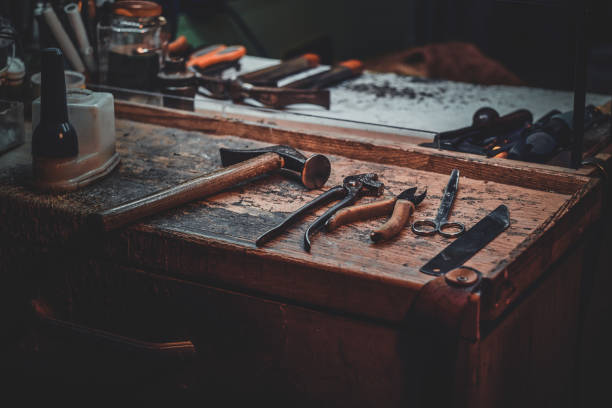 istock Workplace of cobbler with necessary tools on it 1206228726