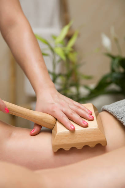 istock Maderotherapy anti-cellulite massage with wooden roller massager 1206228832