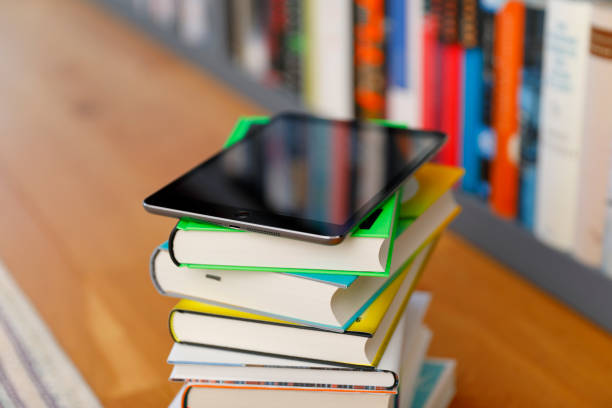 istock Digital Tablet on a Pile of books 1206229073