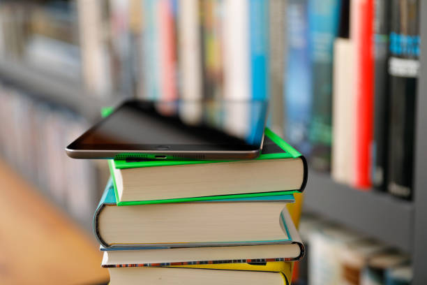 istock Digital Tablet on a Pile of books 1206229414