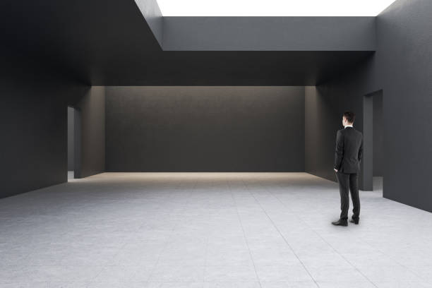 istock Businessman in modern gallery interior 1206229553