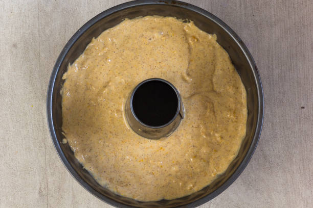 Raw batter for pumpkin cake in bundt pan before baking