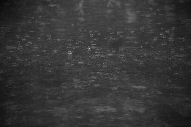 Rain on the floor,rainy day. rain drop on wet asphalt street road.