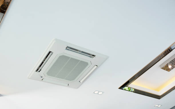 istock white Ceiling mounted cassette type air conditioner in house. 1206235695