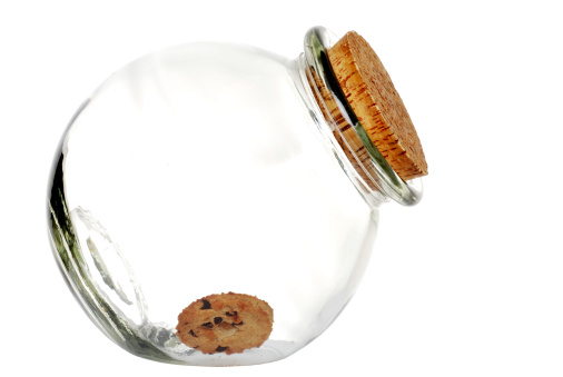 isolated last cookie in the jar on white background