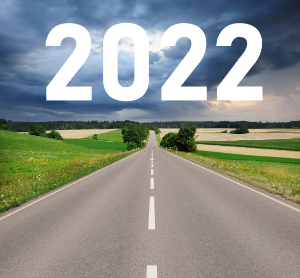 istock 2022 sign over country road , dramatic sky 1206236327