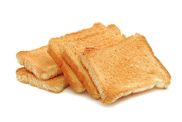 Pile of toasted bread on white background stock photo