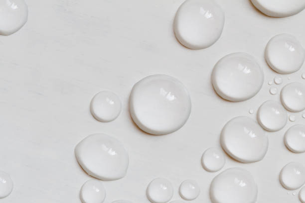 istock Big and small water drops on gray background. Closeup. 1206239546