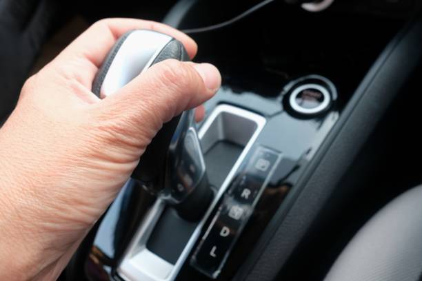 istock hand  holding the gear shift to drive 1206240930