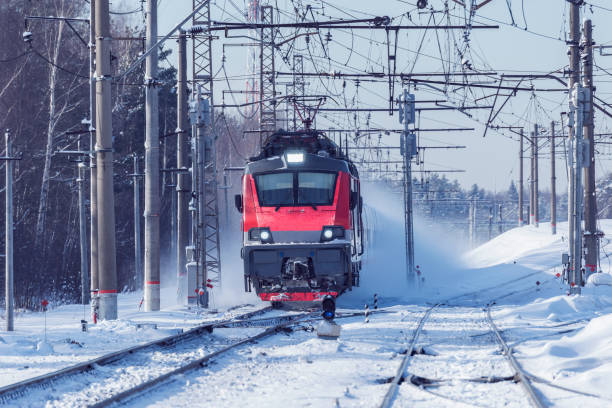istock High speed train approaches to the station at winter day time. 1206241203