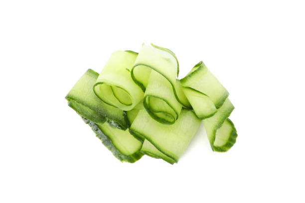 istock Green cucumber slices isolated on white background 1206242873