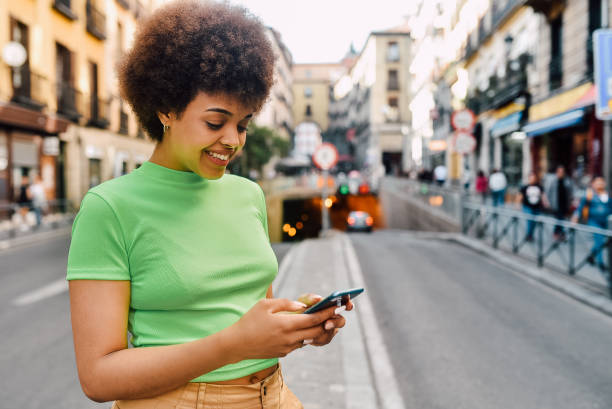istock Cute girl walking and using smartphone 1206243793