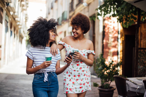 istock Girls in a walk drinking coffee and having fun 1206243908