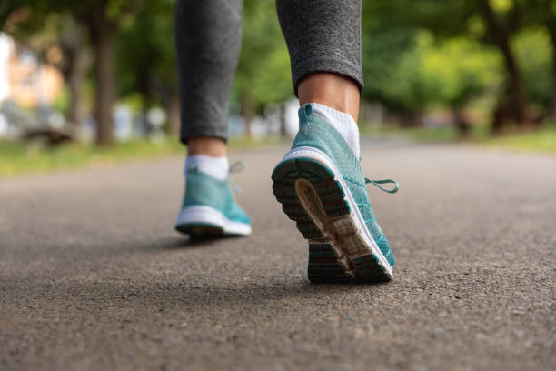 istock Female jogger running in the park 1206245001