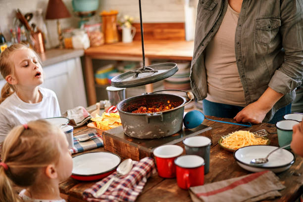 istock Young Family Eating Chili Con Carne 1206245155