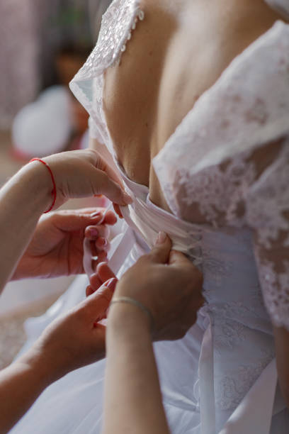istock A young bride buttoned wedding dress. Happy wedding day 1206246787