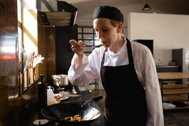 istock Caucasian chef tasting the vegetables 1206247703